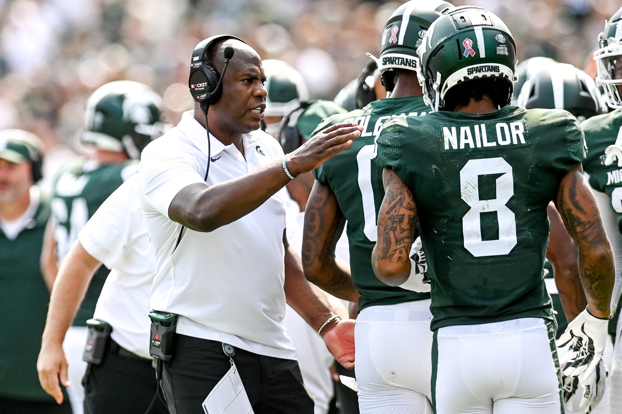 Michigan State Head Football Coach Mel Tucker compliments his players