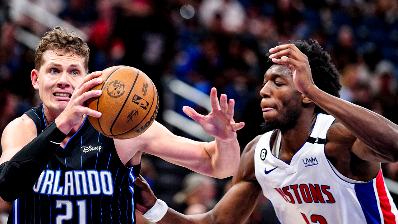 Apr 2, 2023; Orlando, Florida, USA; Orlando Magic center Moritz Wagner (21) dribbles the ball past Detroit Pistons center James Wiseman (13) during the second half at Amway Center. Mandatory Credit: Rich Storry-USA TODAY Sports. Article by Brandon Dent