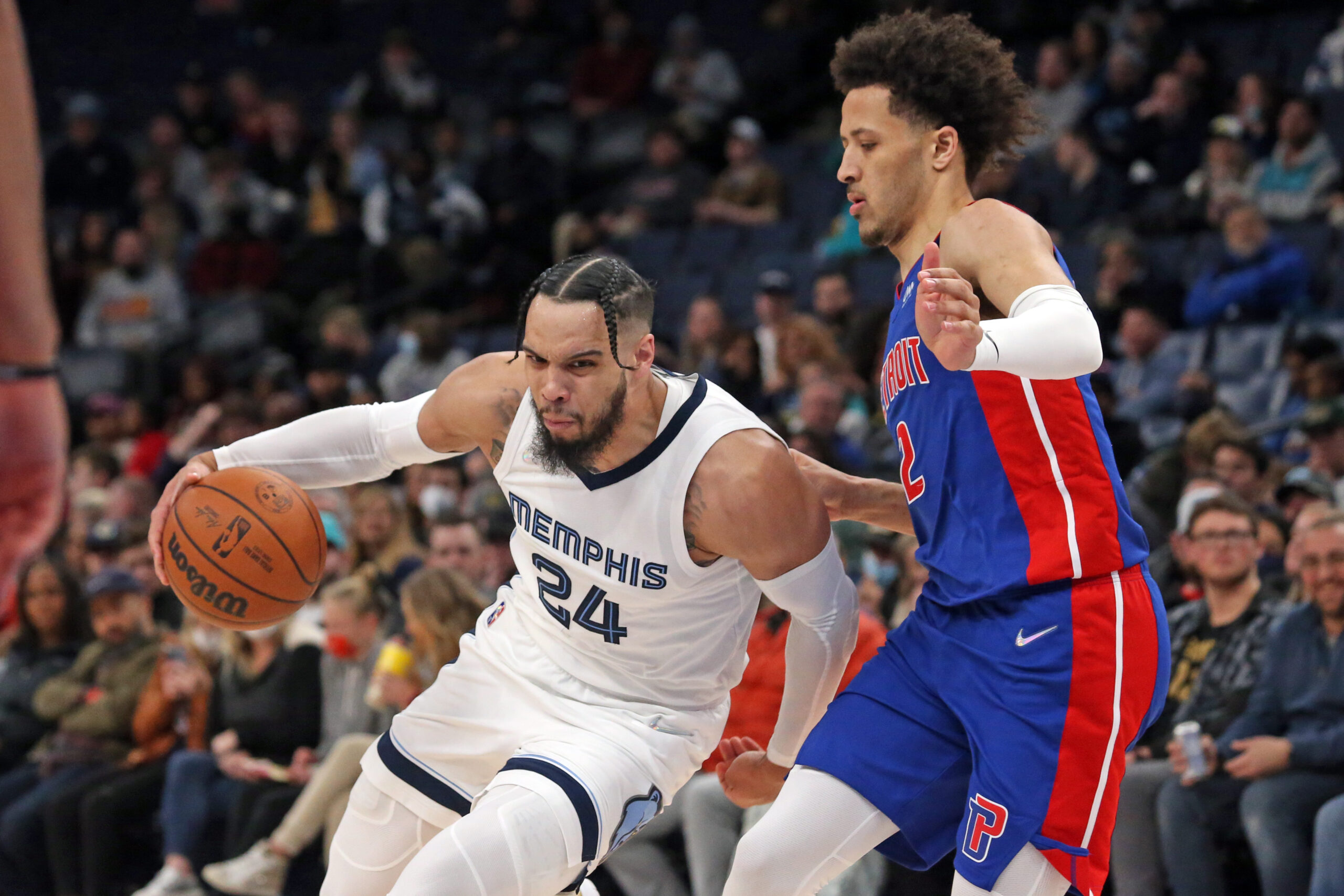 Jan 6, 2022; Memphis, Tennessee, USA; Memphis Grizzles guard Dillon Brooks (24) drives to the basket as Detroit Pistons guard Cade Cunningham (2) defends during the second half at FedExForum. Mandatory Credit: Petre Thomas-USA TODAY Sports. Article by Brandon Dent