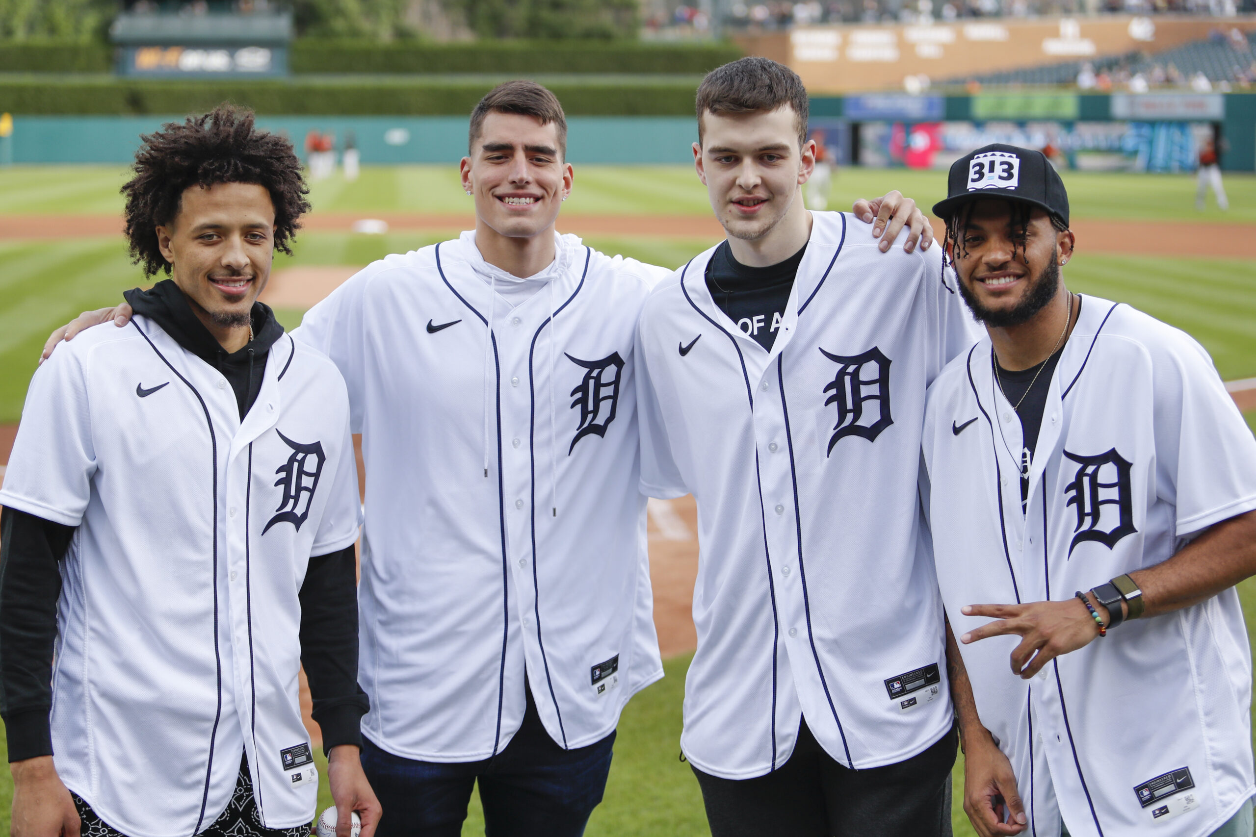 Jul 30, 2021; Detroit, Michigan, USA; (Left to right) Detroit Pistons number one overall draft pick Cade Cunningham number three pick Luka Garza number four pick Balsa Koprivica and number two pick Isaiah Livers smile for a photo before the game between the Detroit Tigers and the Baltimore Orioles at Comerica Park. Mandatory Credit: Raj Mehta-USA TODAY Sports. Article by Brandon Dent